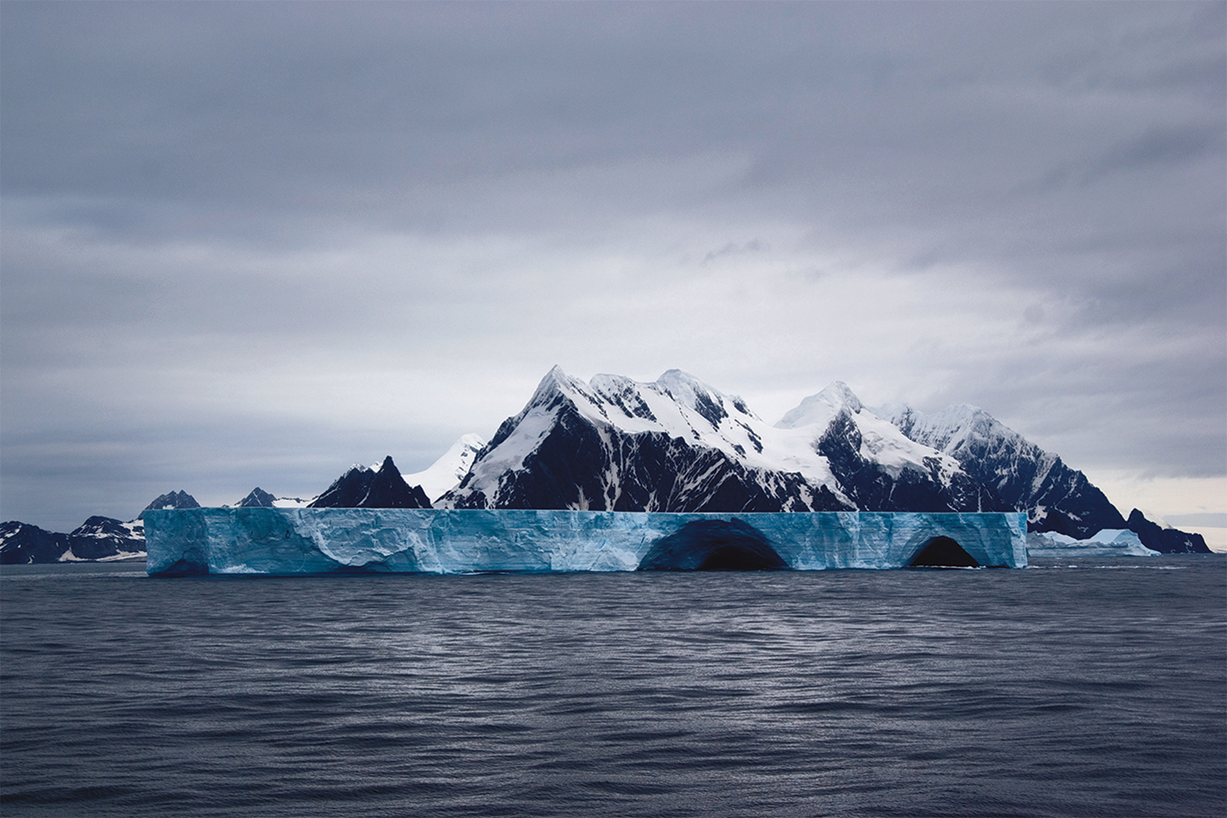 Ice-covered mountains and floating icebergs off Elephant Island, Antarctica