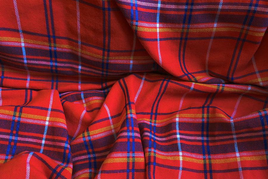 Traditionally worn by the Maasai in East Africa, the shuka bears a history as rich as its colours