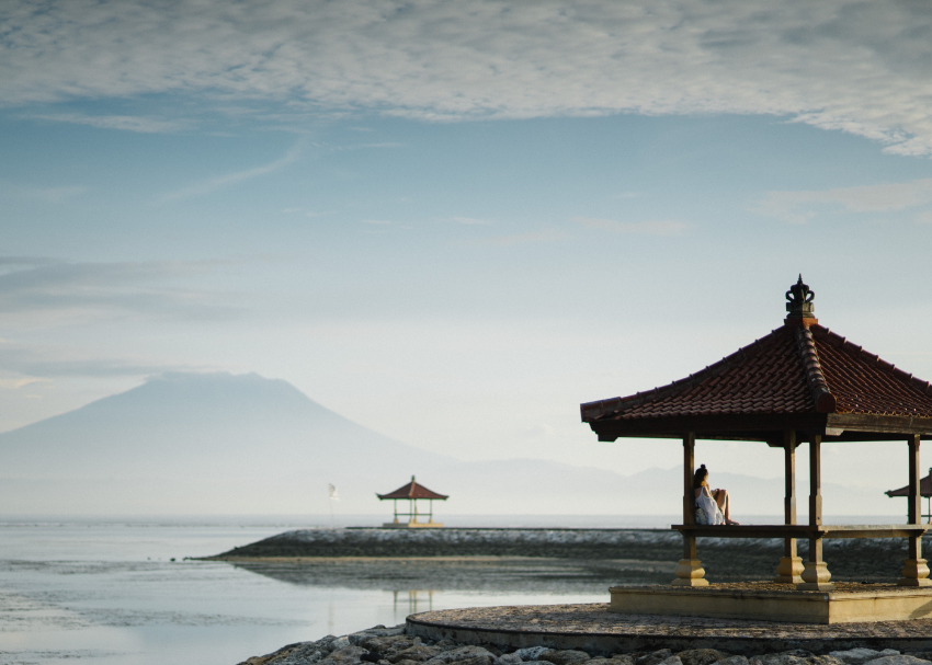 Sea framed by mountains and pagodas in Bali